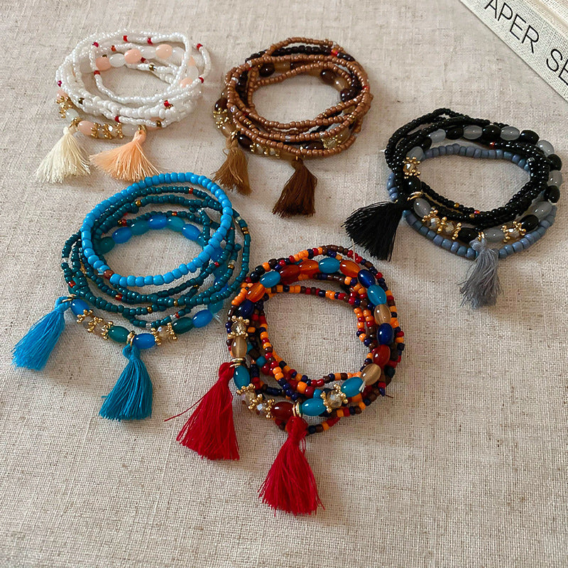 Pulsera de cuentas de arroz con borlas